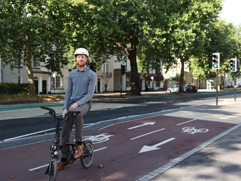 Ed Clancy cycles down South Parade 